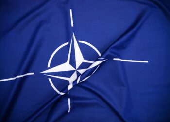 NATO flag.North Atlantic Treaty Organization flag waving.