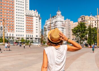 Young woman tourist in Plaza España in the center of the capital of Madrid