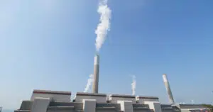 smoke from chimney in factory over blue sky 2026 03 24 23 04 26 utc